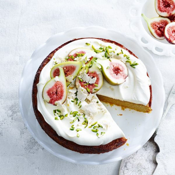 Overhead View Of Orange And Almond Cake With Yoghurt Cream Pistachios Figs And Cake Server.jpg